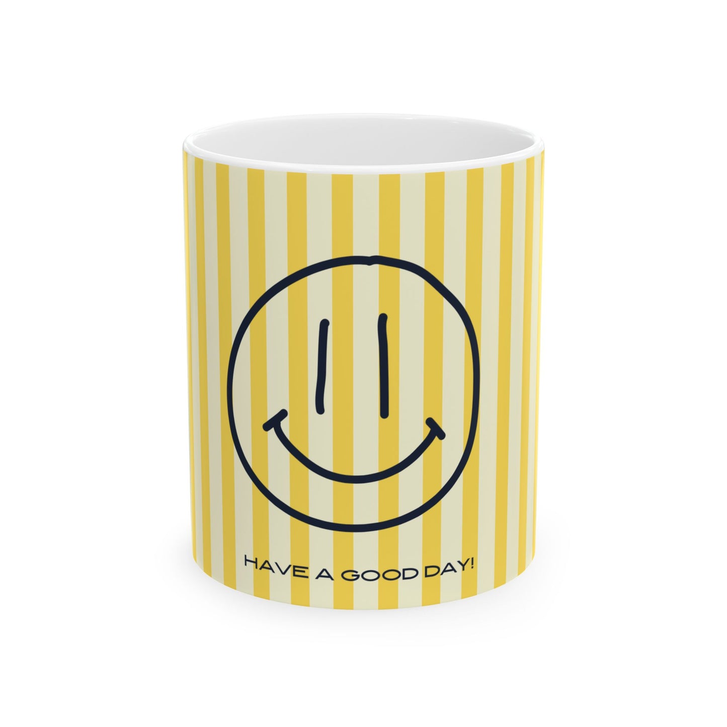 A white ceramic mug with yellow and cream vertical stripes, featuring a black smiley face graphic and the text 'HAVE A GOOD DAY!' printed near the bottom.