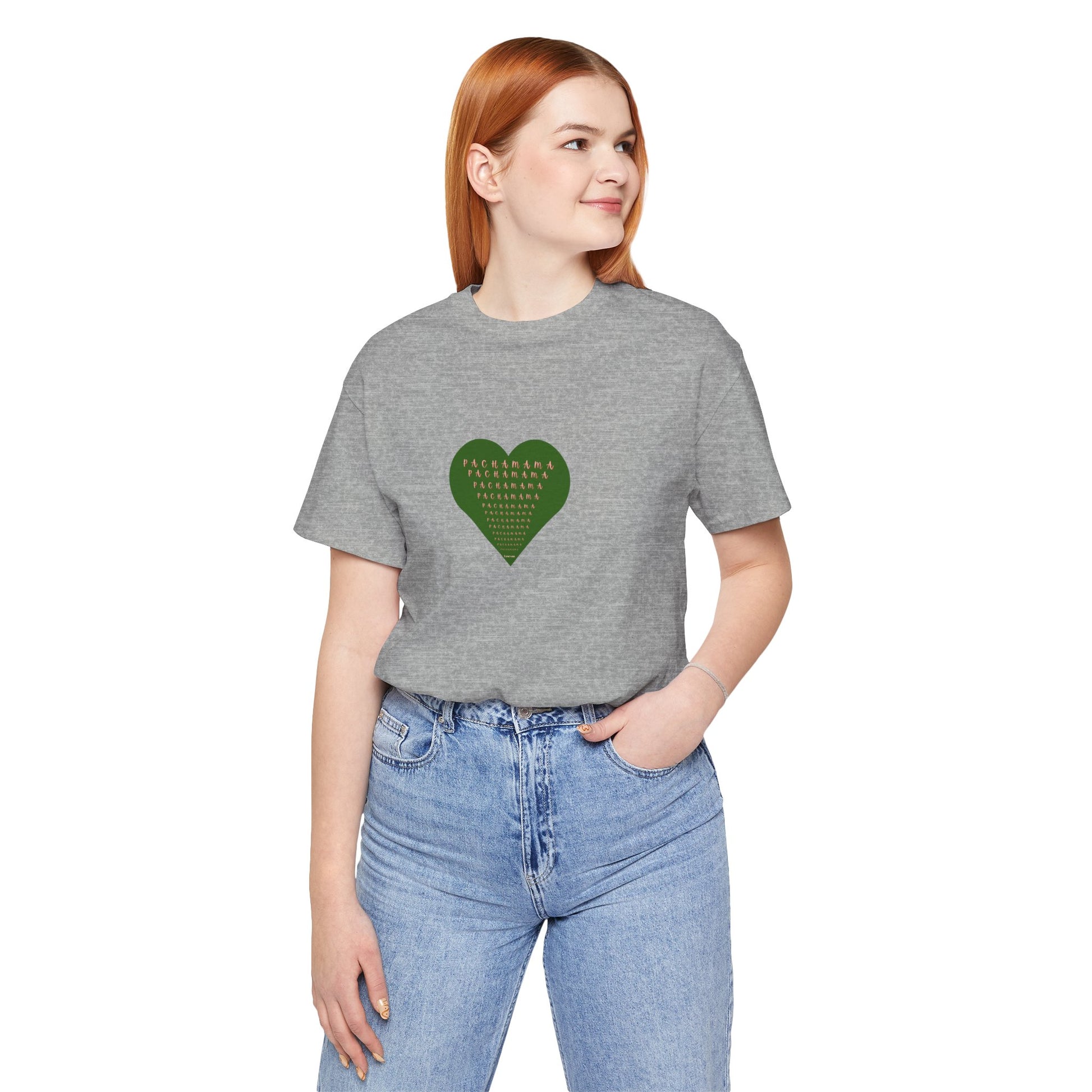 Person wearing a gray t-shirt with a green heart design on a white background