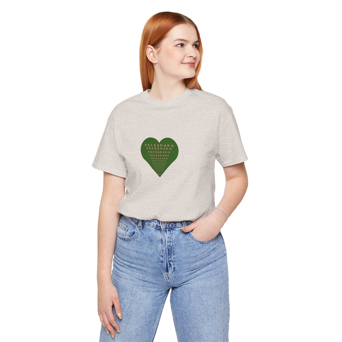 Person wearing a beige t-shirt with a green heart design on a white background