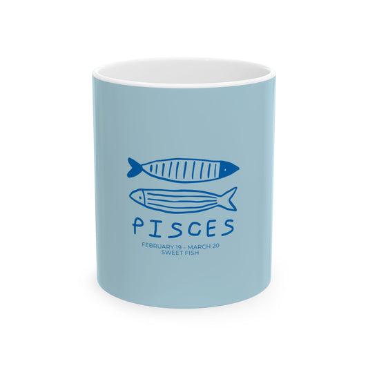 A light blue ceramic mug with a white interior, featuring a dark blue Pisces zodiac design with two fish illustrations and the text 'PISCES' and 'FEBRUARY 19 - MARCH 20 SWEET FISH'.