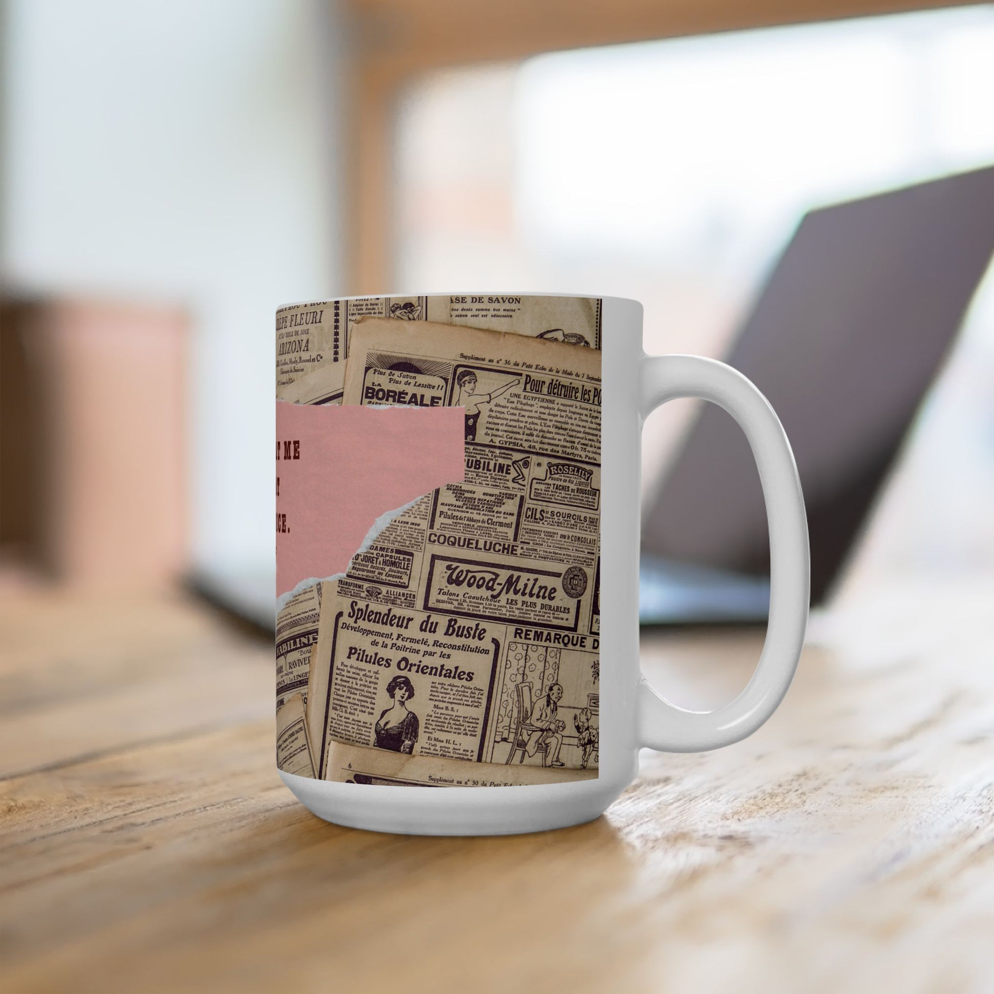 Mug with vintage newspaper design on a wooden surface