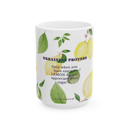 Mug with lemon design and Ukrainian proverb text on a white background
