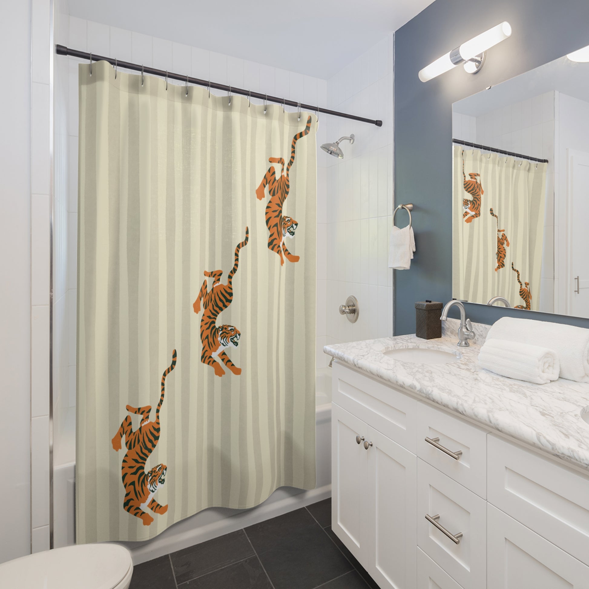 Bathroom with a shower curtain featuring tiger designs, white vanity, and mirror.