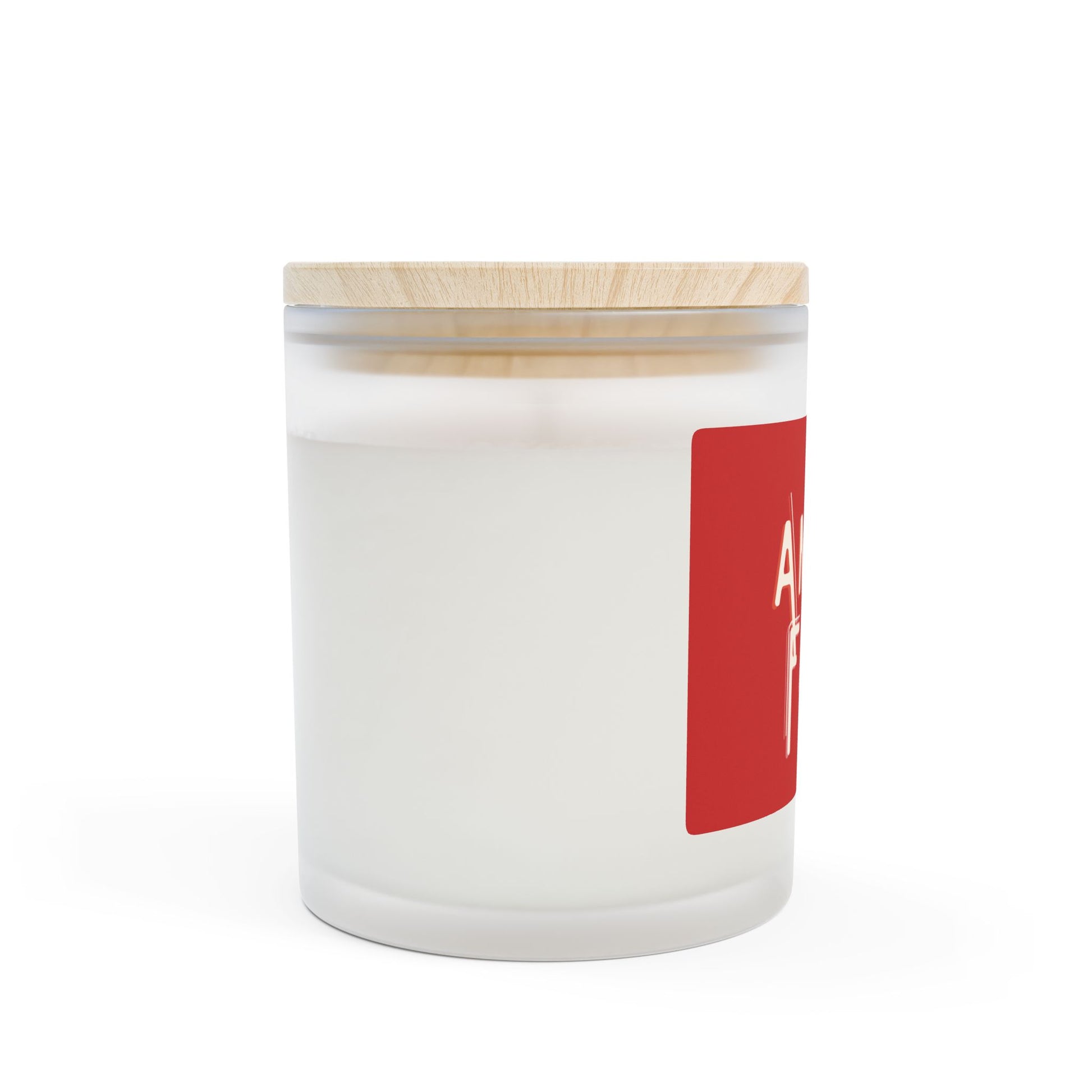 White candle in a glass jar with a wooden lid and red label on a white background