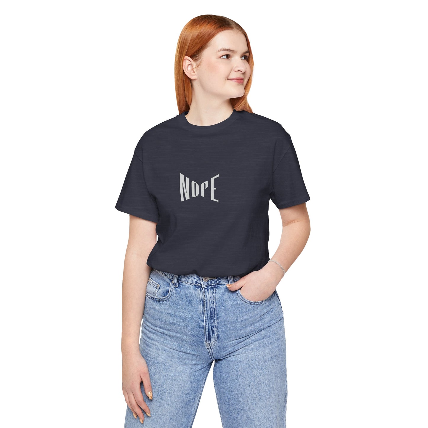 Person wearing a black t-shirt with 'NOPE' text and blue jeans on a white background