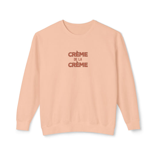 Beige sweatshirt with 'Crème de la Crème' text on a white background