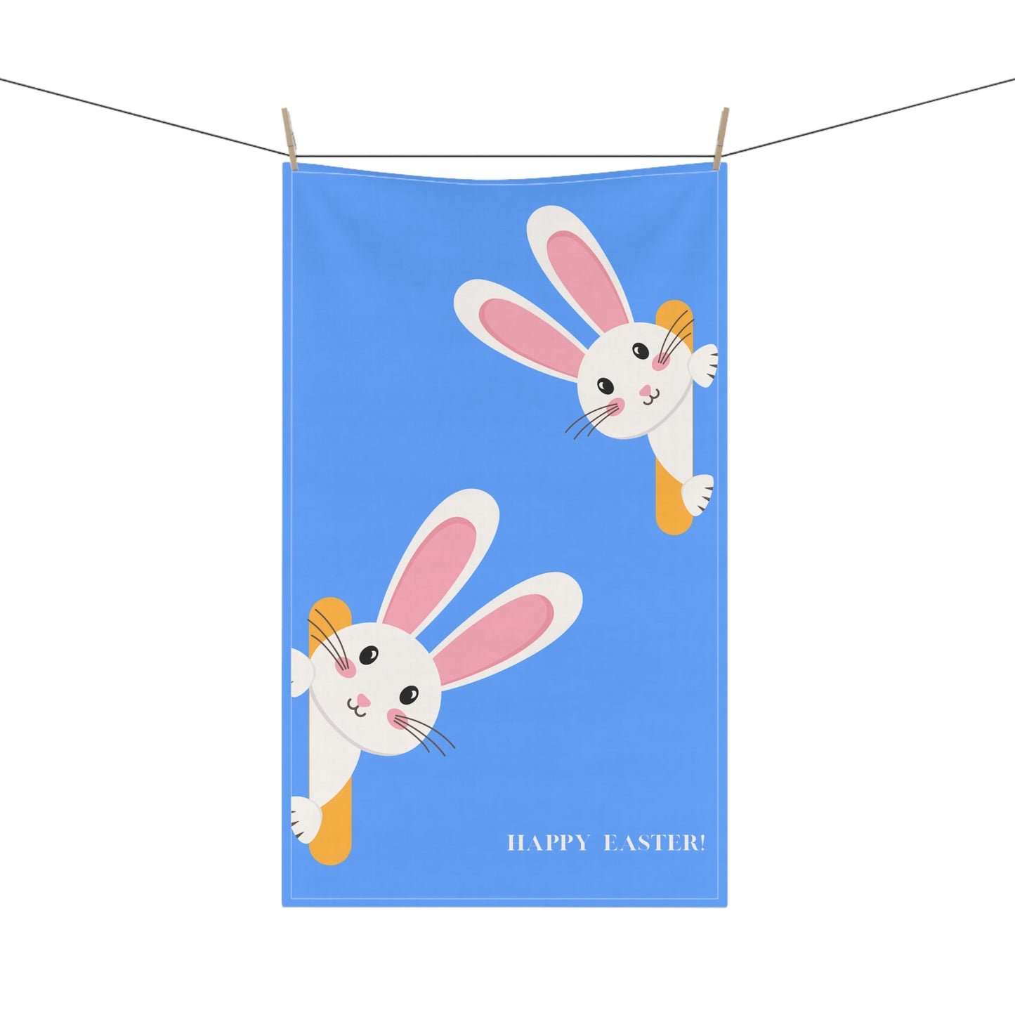 Tea towel with cartoon bunnies and 'Happy Easter!' text on a blue background