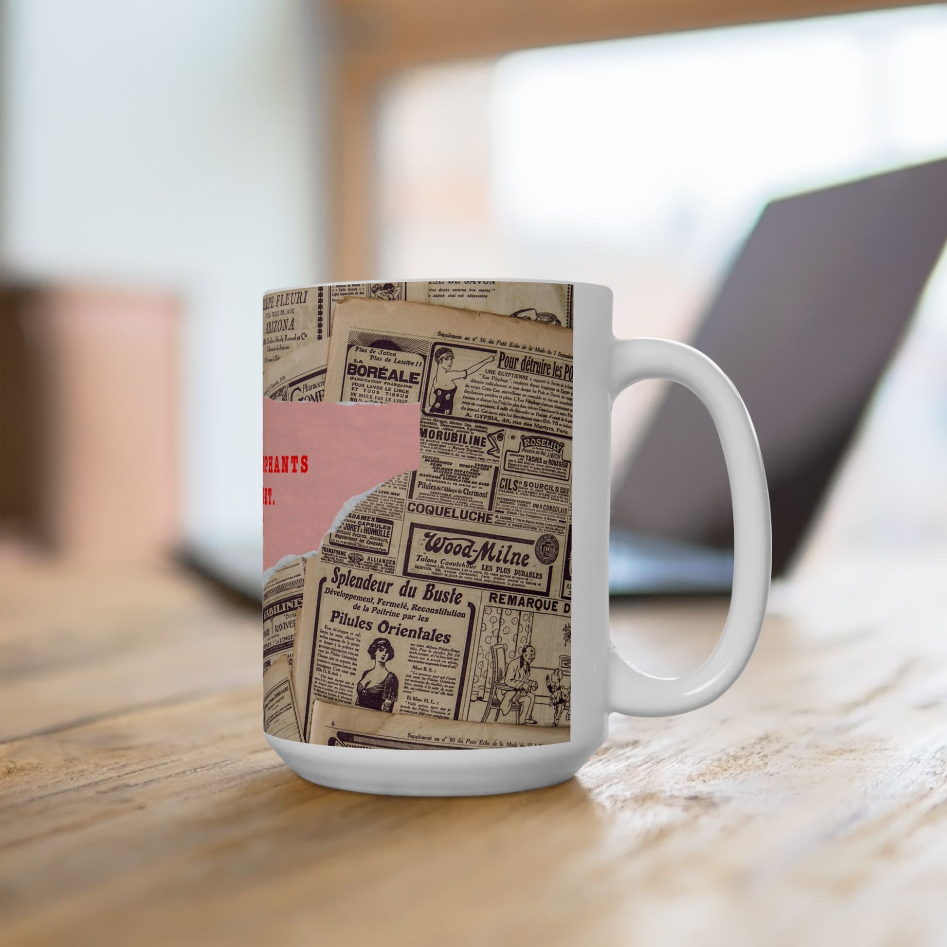 Mug with vintage newspaper design on a wooden surface