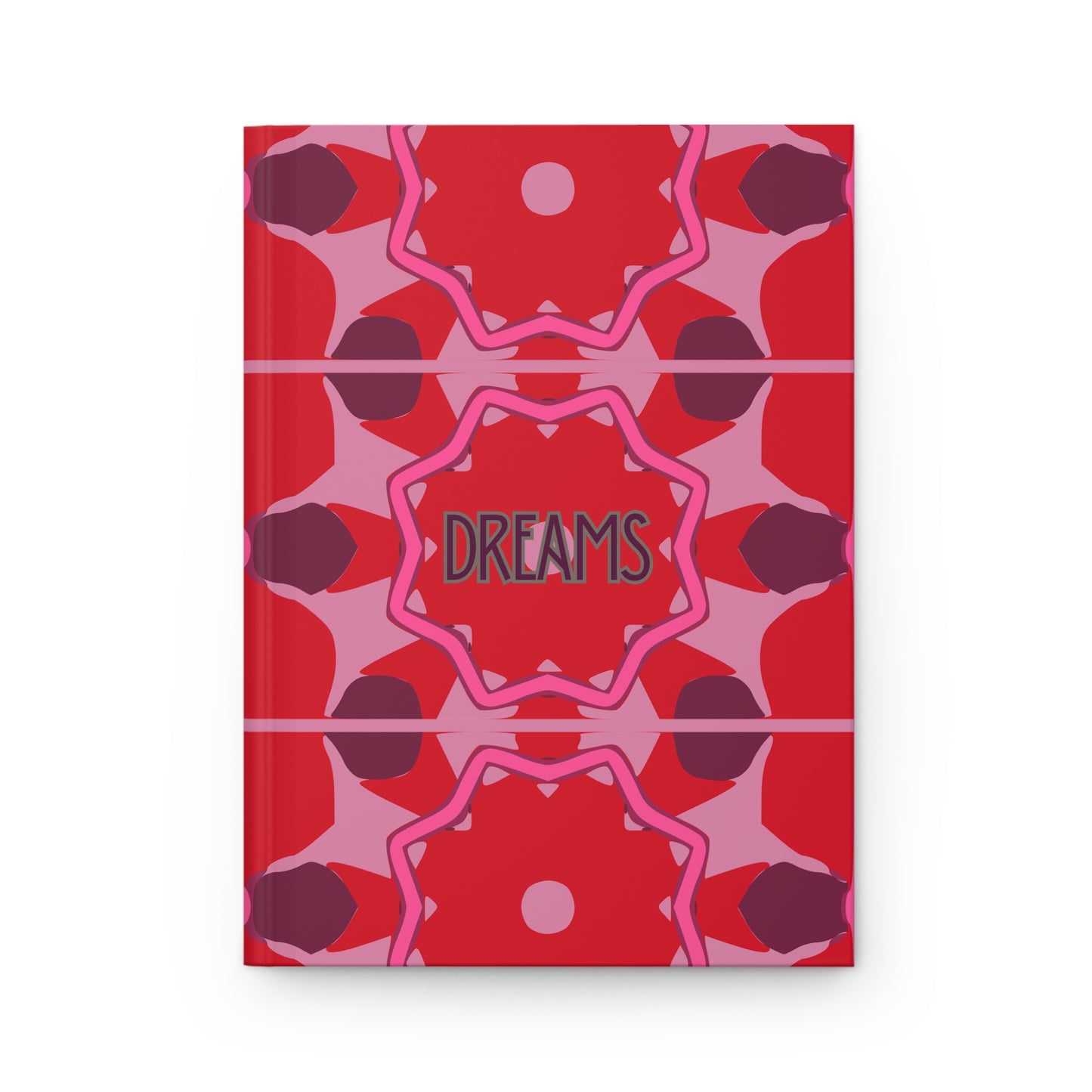 Notebook with red and pink geometric pattern and 'DREAMS' text on a white background