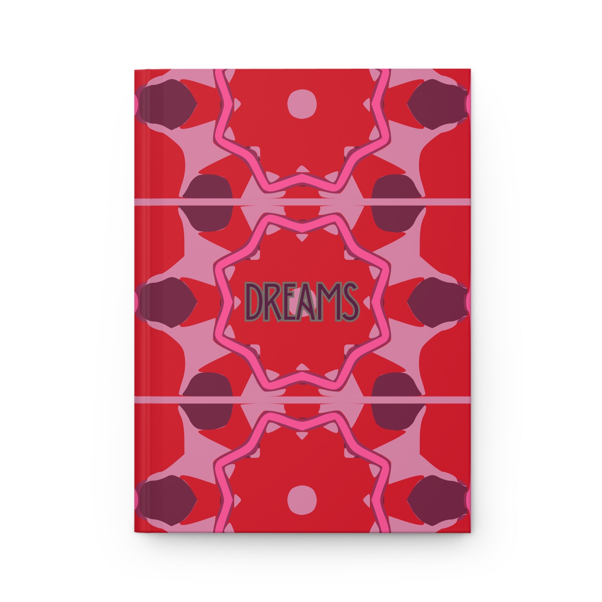 Notebook with red and pink geometric pattern and 'DREAMS' text on a white background