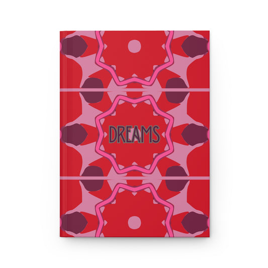 Notebook with red and pink geometric pattern and 'DREAMS' text on a white background