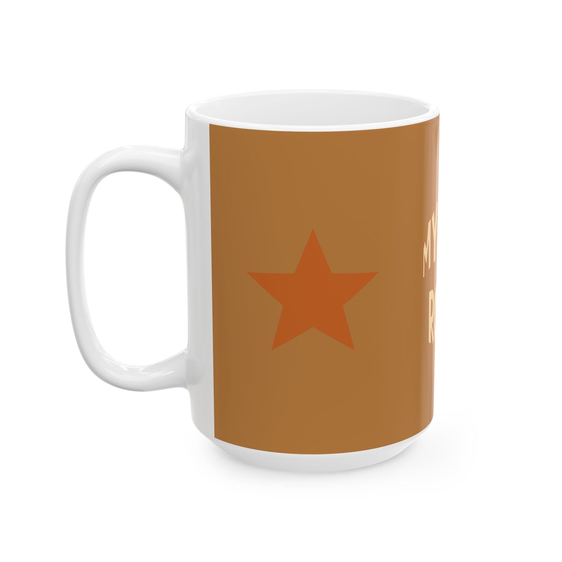 White mug with a brown background and orange star design on a white background