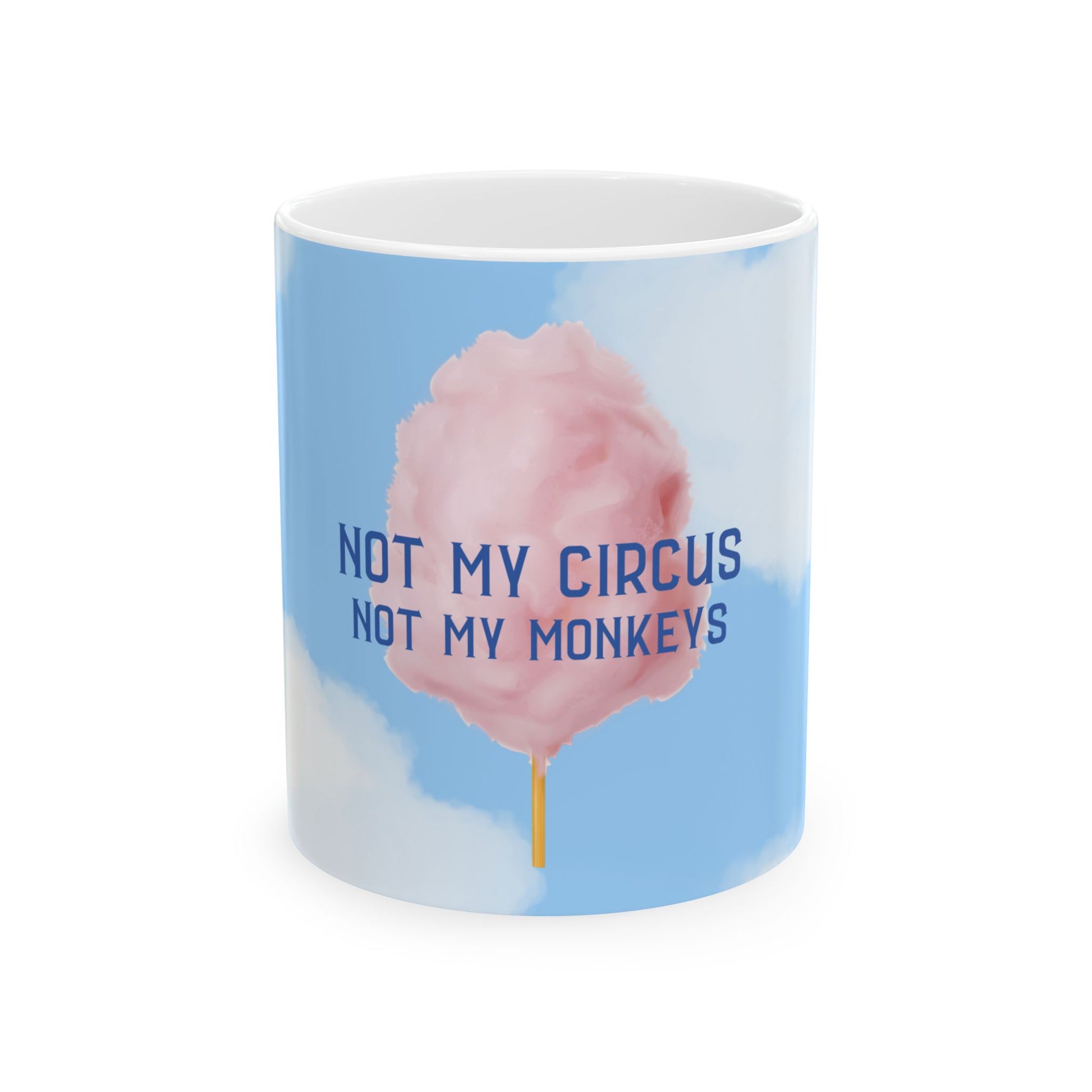 A white ceramic mug featuring a light blue sky graphic with a pink cotton candy illustration and the text 'NOT MY CIRCUS NOT MY MONKEYS' in blue, shown on a white background.
