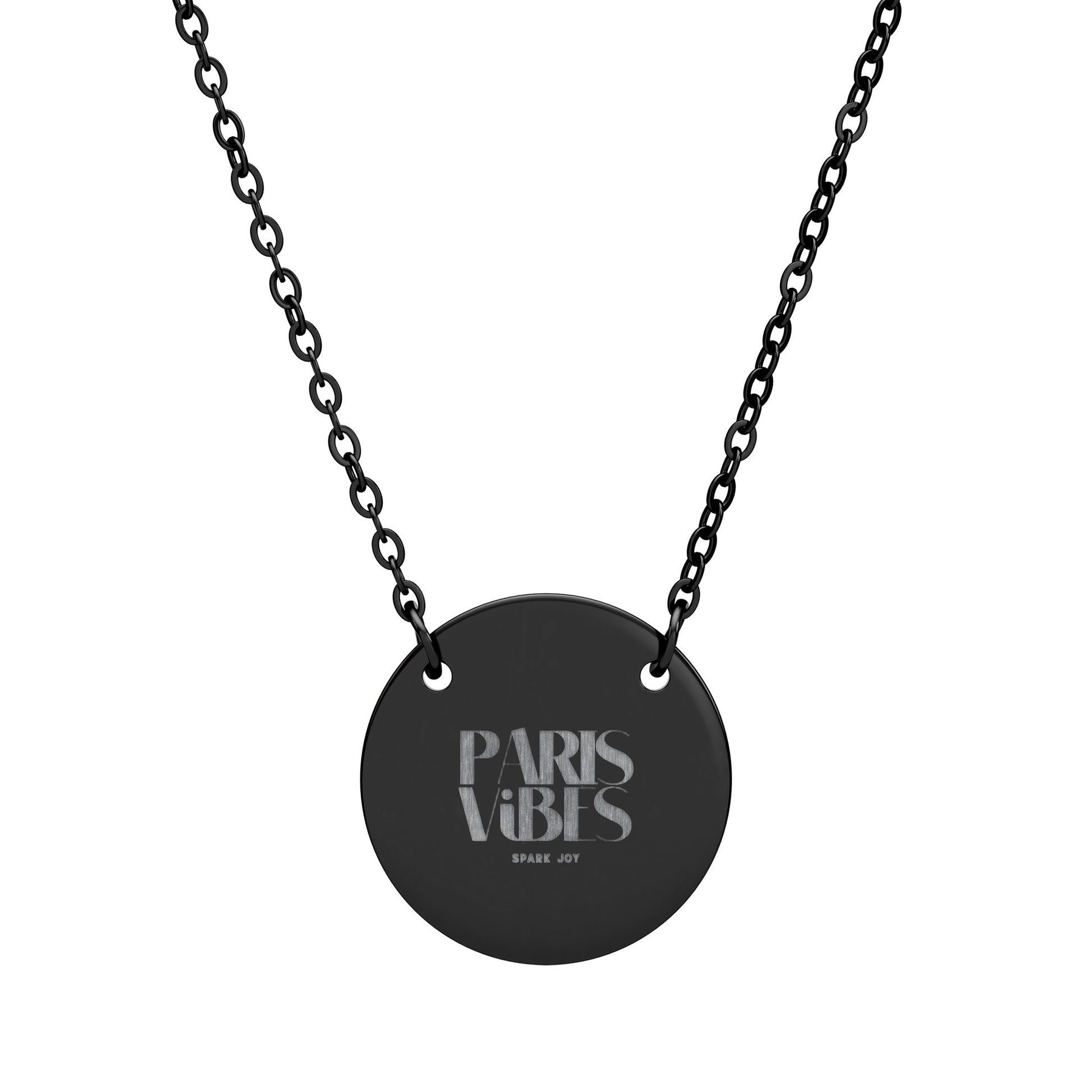 Black necklace with a round pendant featuring 'Paris Vibes' text on a white background