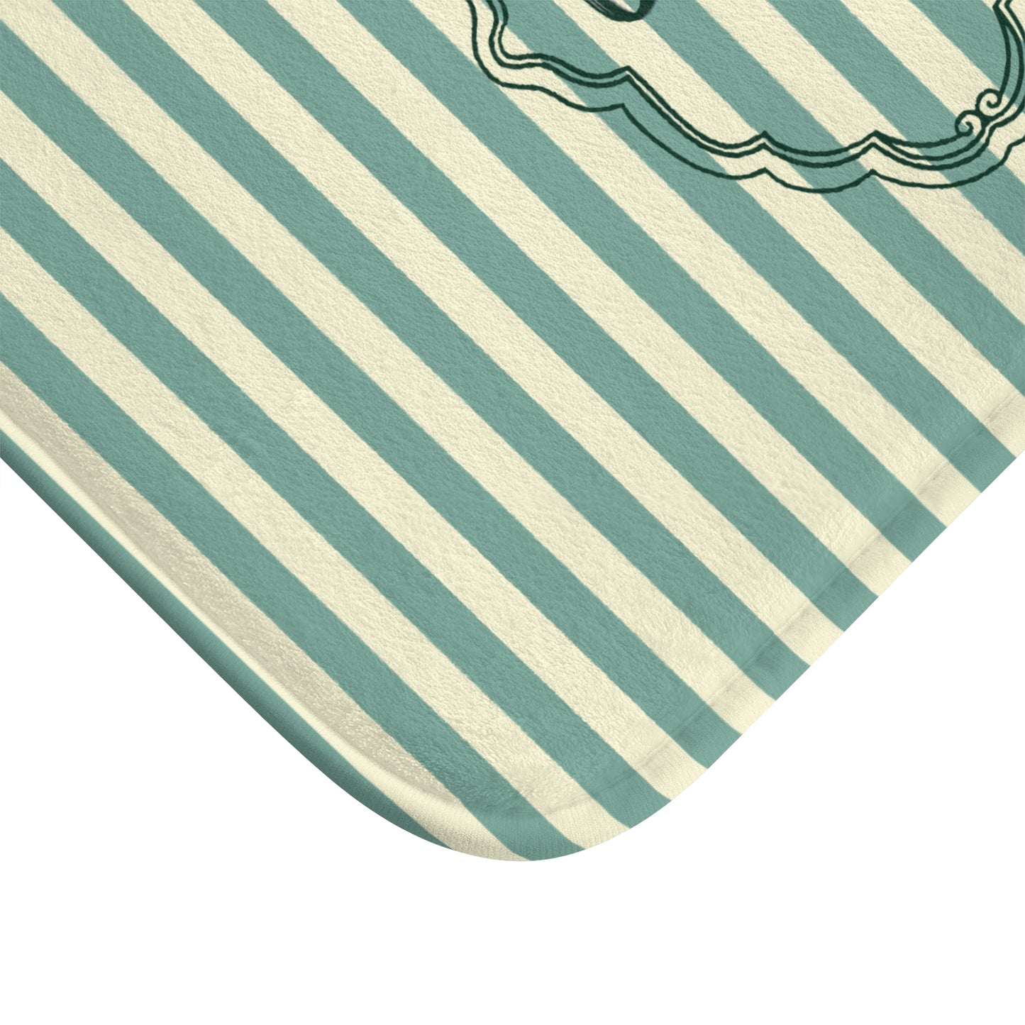 Close-up of a green and white striped fabric with a decorative border.