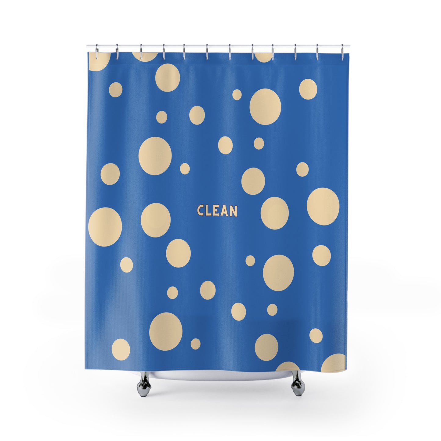 A blue shower curtain with a pattern of beige polka dots and the word 'CLEAN' printed in gold near the center, shown hanging from silver hooks over a white tub against a white background.