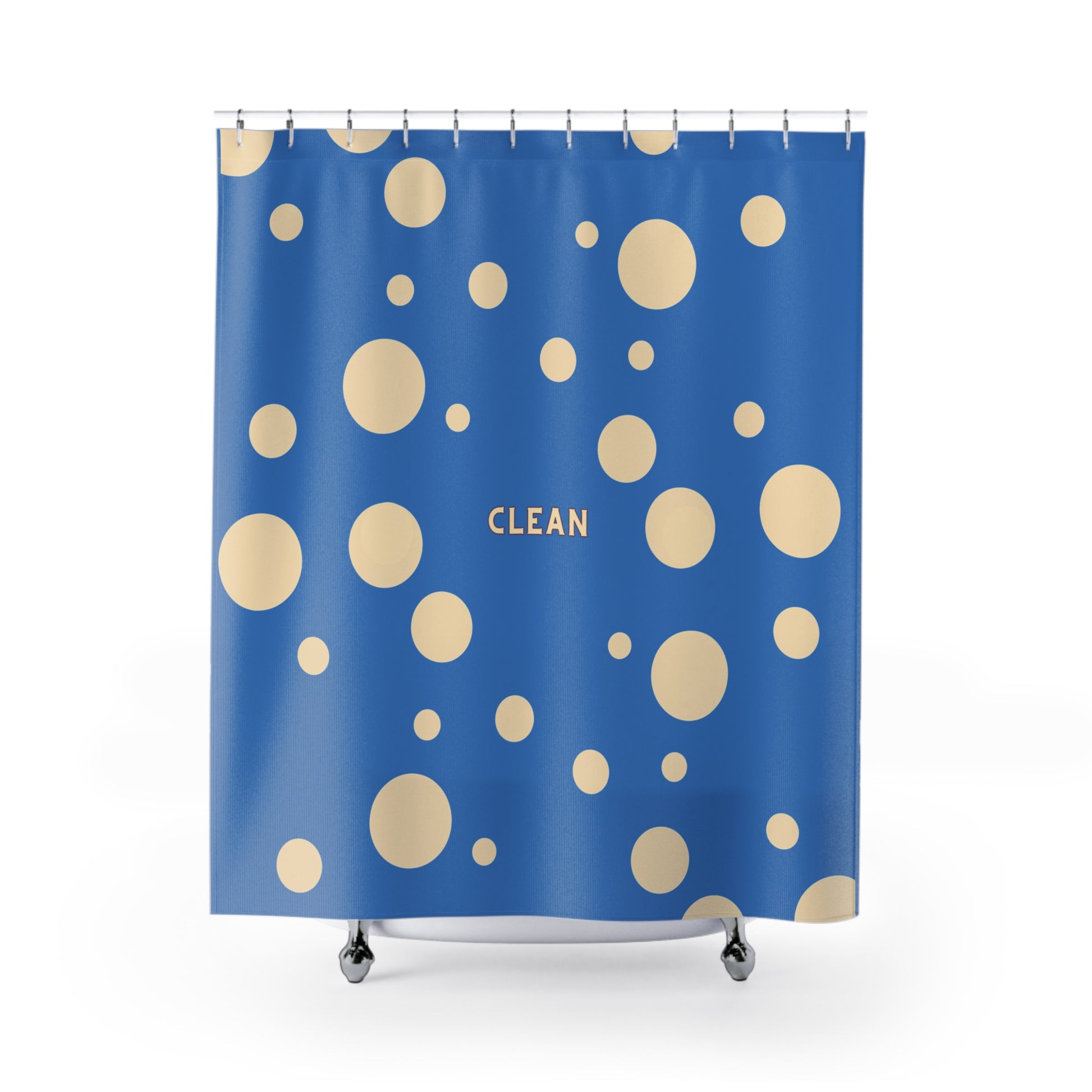 A blue shower curtain with a pattern of beige polka dots and the word 'CLEAN' printed in gold near the center, shown hanging from silver hooks over a white tub against a white background.