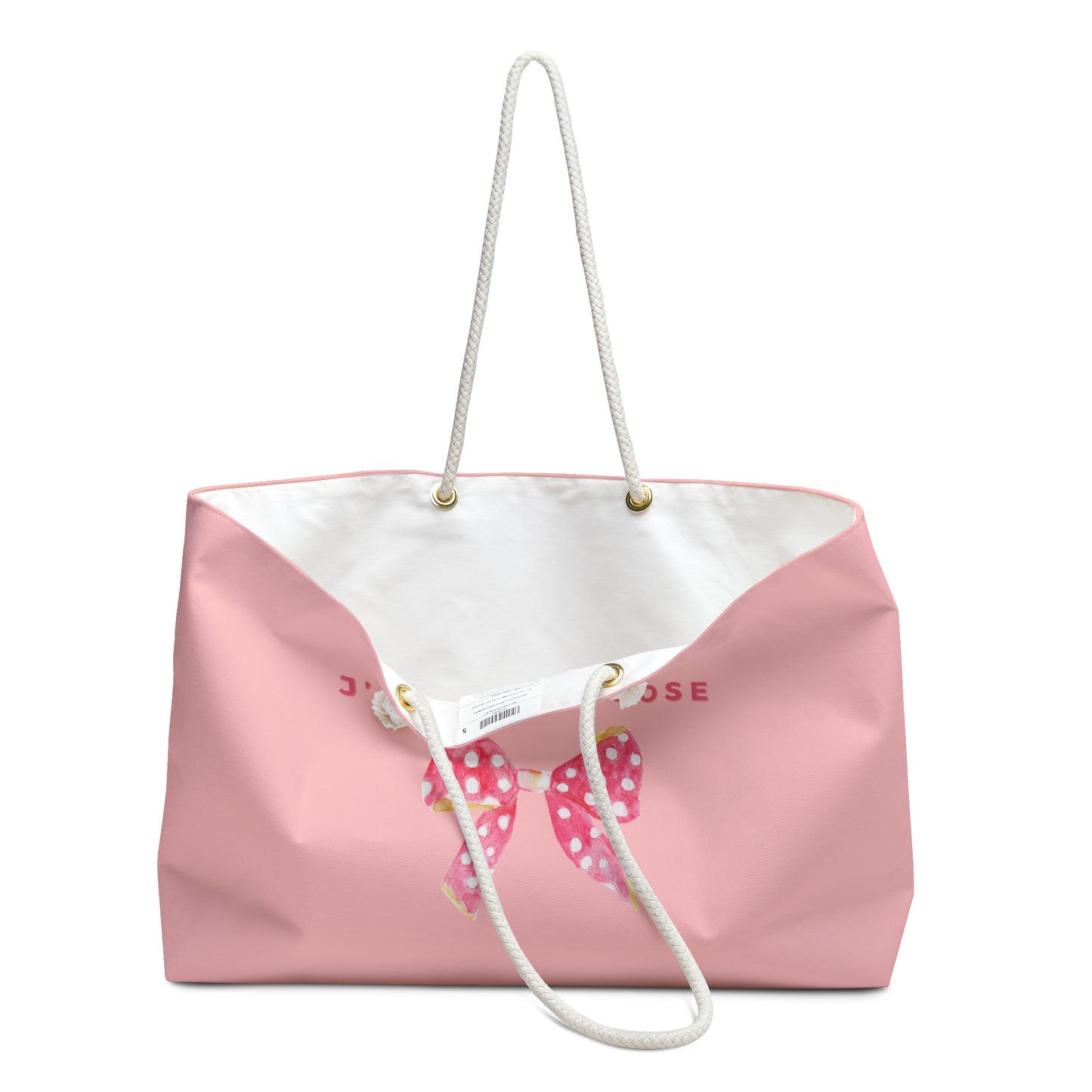Pink tote bag with white top and bow design on a white background