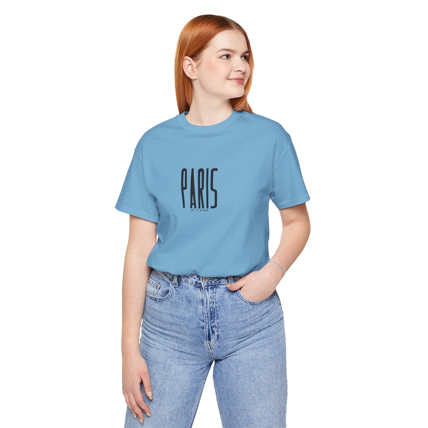 Person wearing a light blue t-shirt with 'PARIS' text on a white background