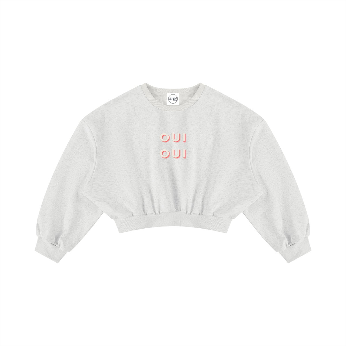 A light heather gray cropped crewneck sweatshirt with 'OUI' printed in a coral-pink outline font on the chest, displayed flat against a solid white background.