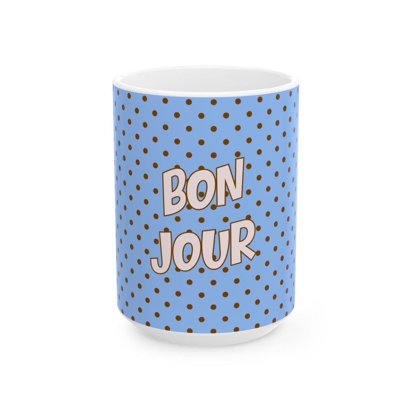 Mug with blue polka dot pattern and 'Bonjour' text on a white background