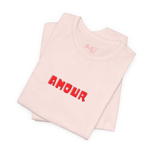 Folded pink tank top with 'AMOUR' printed in red on a white background