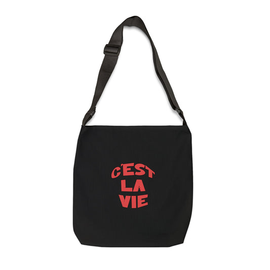 Black bag with red text 'C'EST LA VIE' on a white background