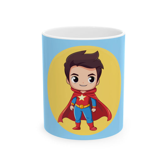 A light blue ceramic mug with a cartoon superhero graphic on the front, featuring a yellow circular background and a chibi-style character in a red cape and blue suit, shown on a white background.