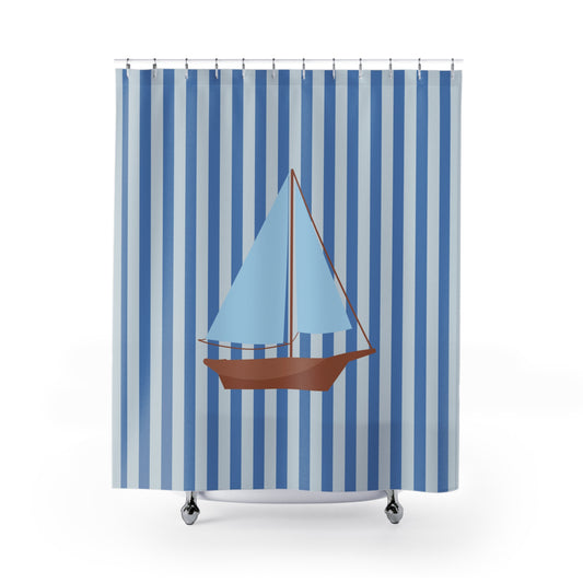 A shower curtain featuring a vertical blue and white stripe pattern with a central illustration of a sailboat in light blue and brown, shown hanging on a white background.
