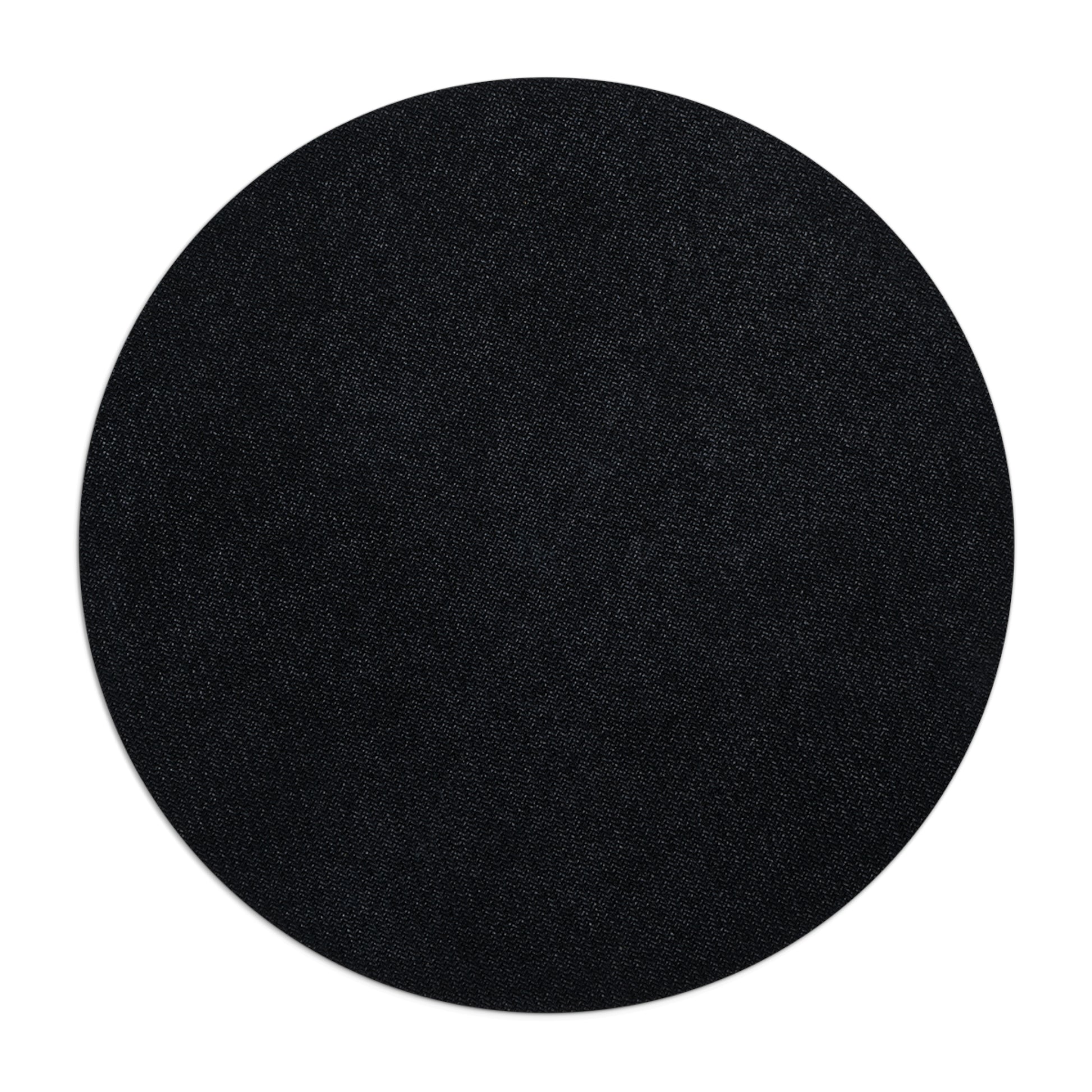 Black circular object on a white background