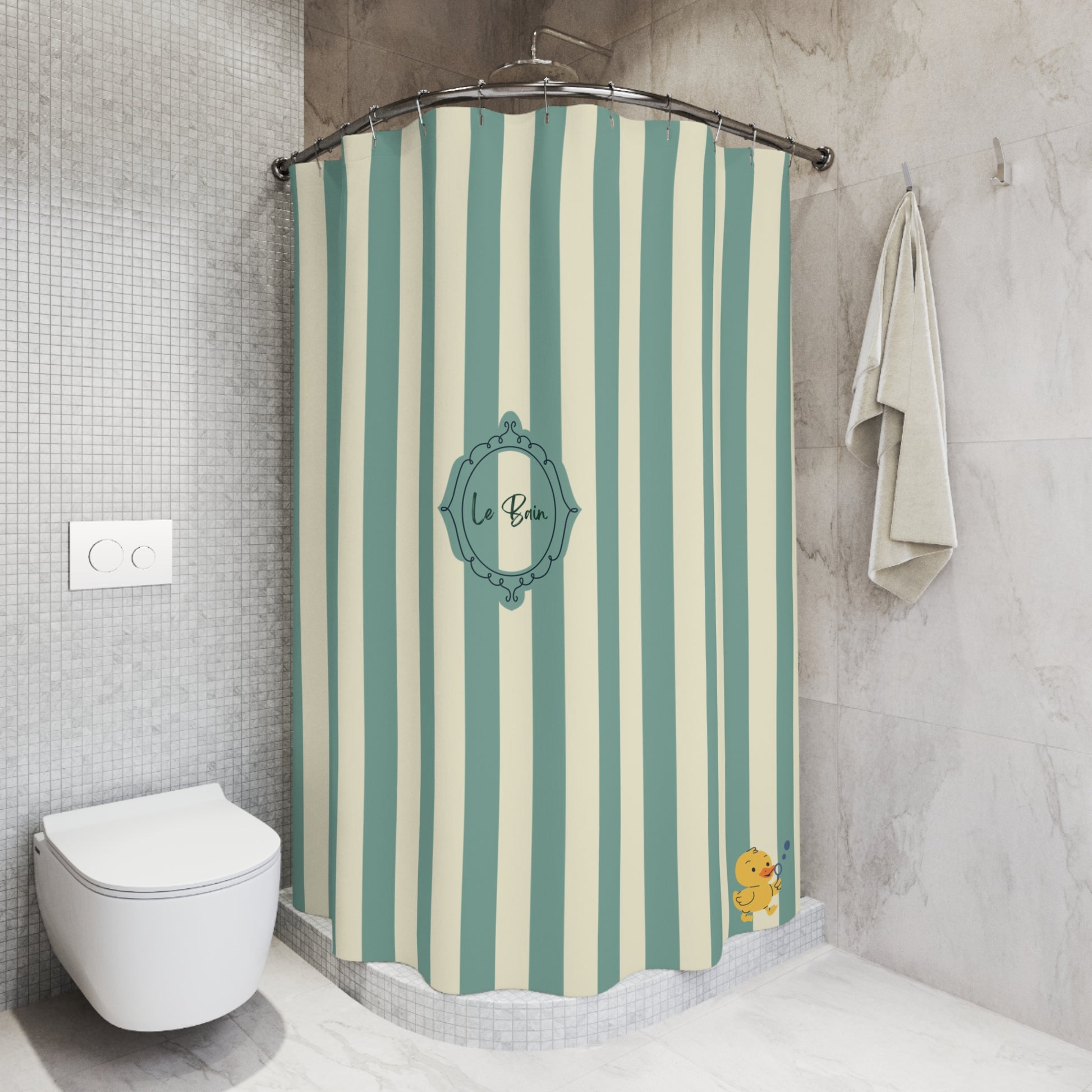 A shower curtain with vertical mint green and cream stripes, featuring a central teal decorative frame with the text 'le Bain' and a small yellow duck character in the bottom right corner. The curtain is shown hanging in a modern tiled bathroom next to a white toilet and a hanging towel.