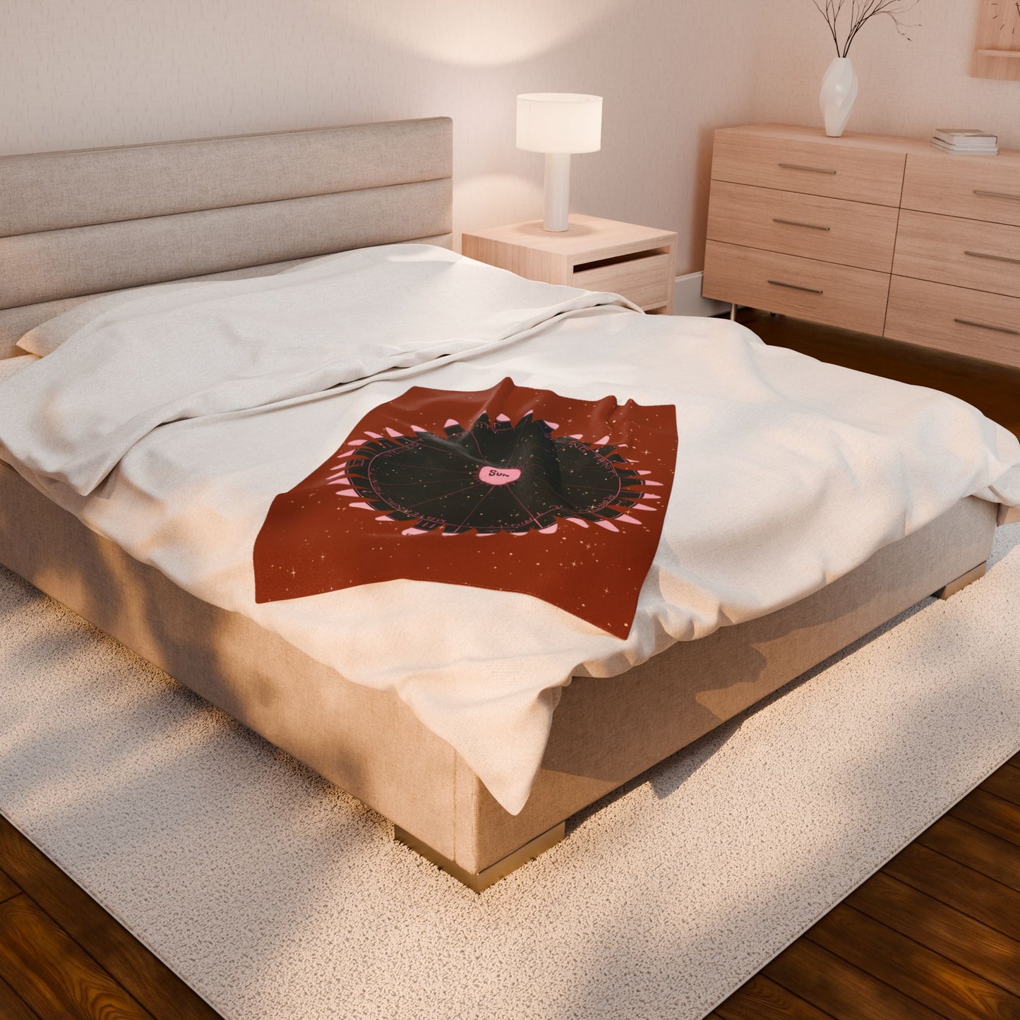 Bedroom with a bed featuring a decorative pillow and a nightstand with a lamp.