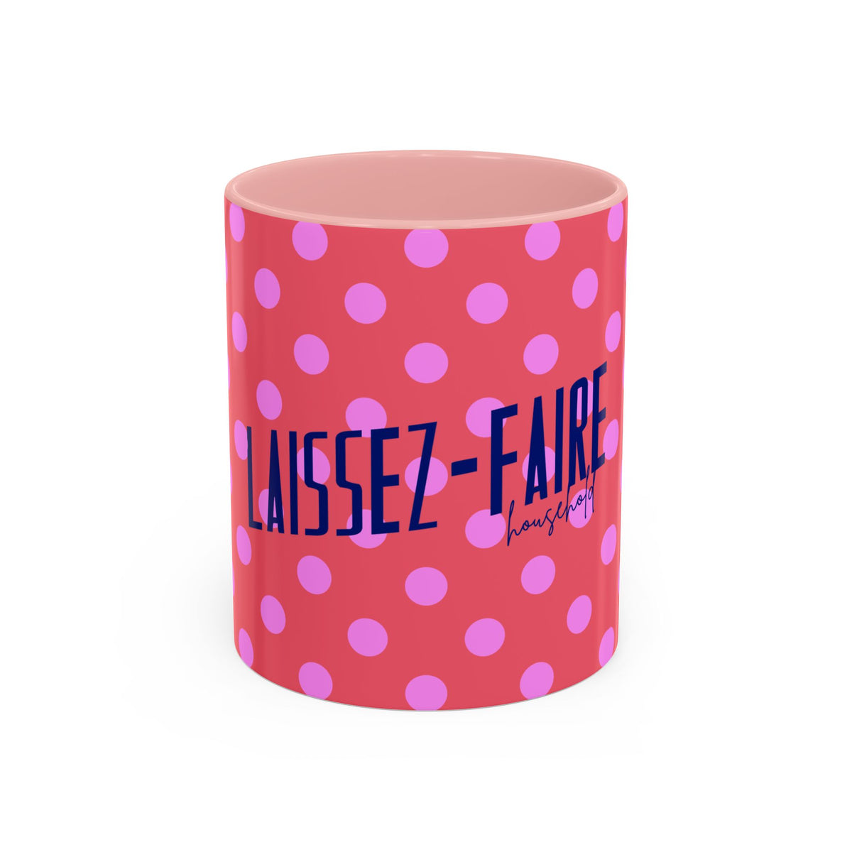 A pink ceramic mug with a pink and purple polka dot pattern and the text 'LAISSEZ-FAIRE housing' printed on the front, set against a plain white background.