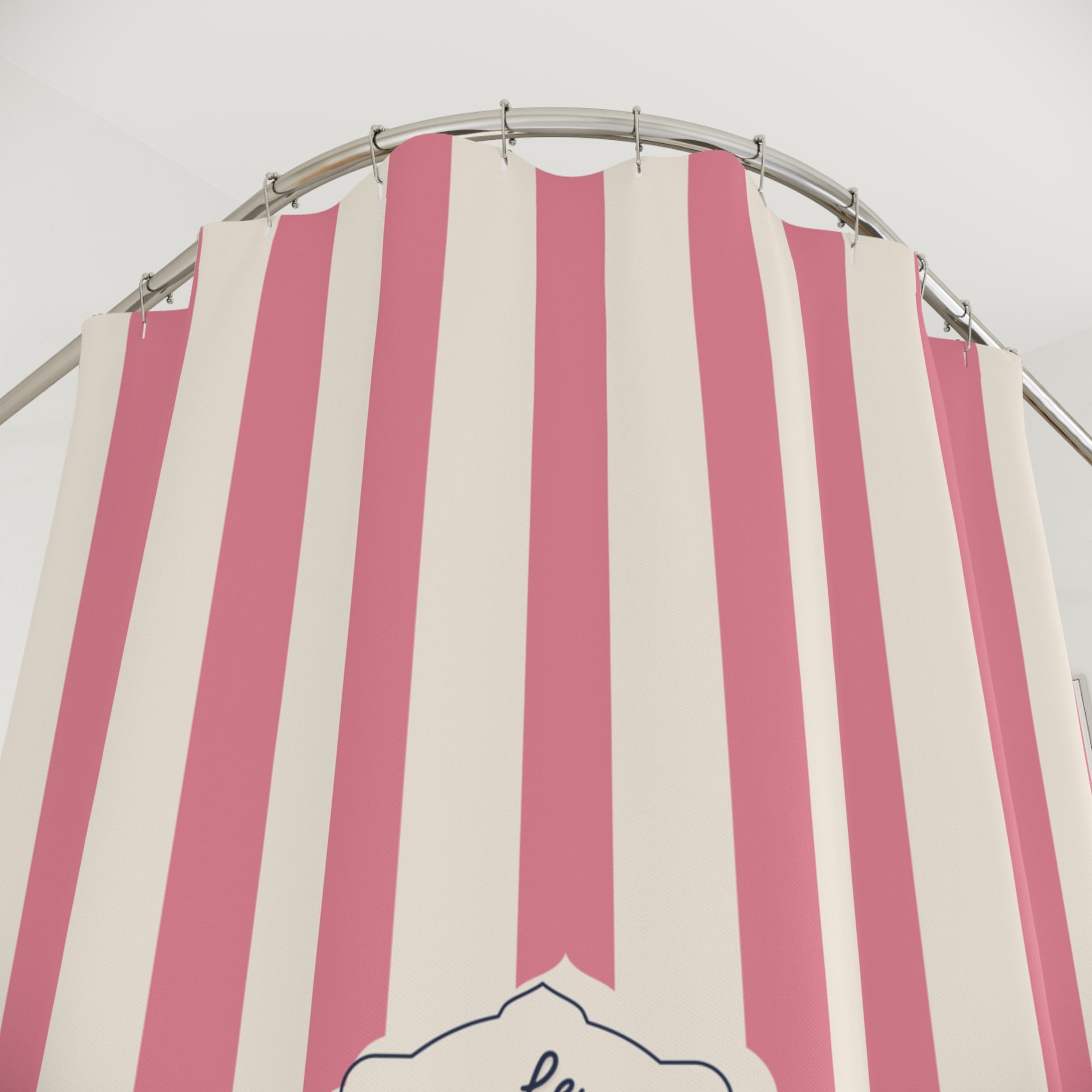 Pink and white striped canopy with a circular metal frame against a light gray background