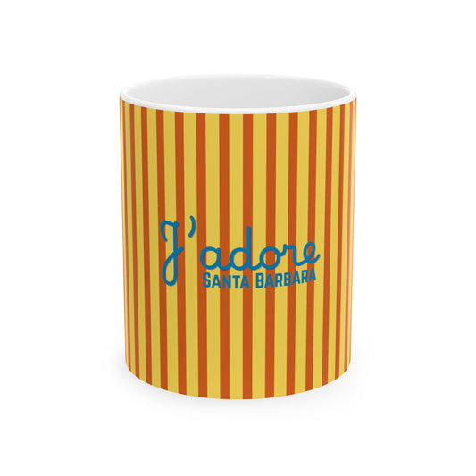 A white ceramic mug featuring a yellow and orange vertical striped pattern, with the blue text 'I adore SANTA BARBARA' printed on the front, set against a plain white background.