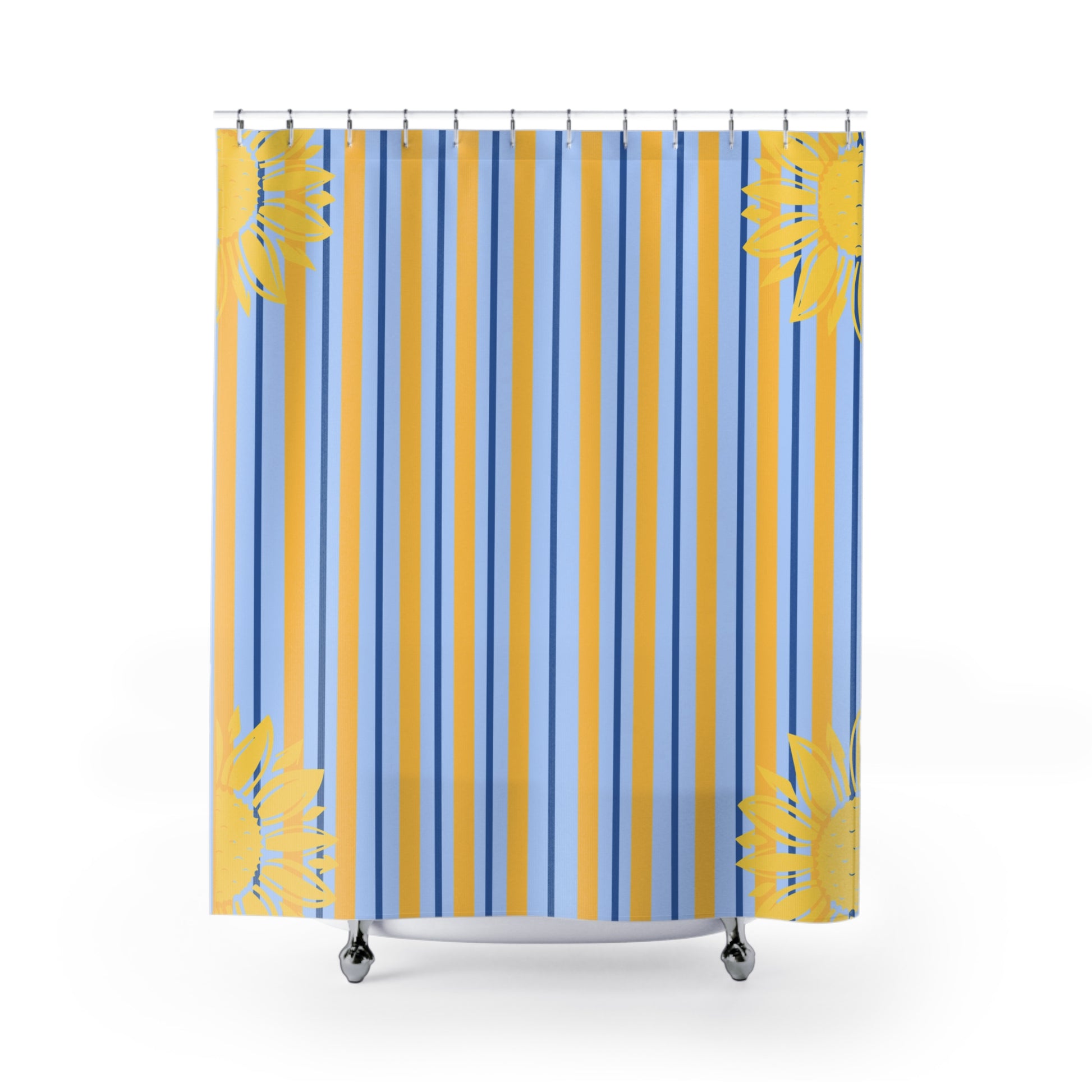 A shower curtain featuring a vertical stripe pattern in light blue, medium blue, and mustard yellow, with yellow tropical palm leaf prints at the corners, shown hanging from silver hooks on a white background.