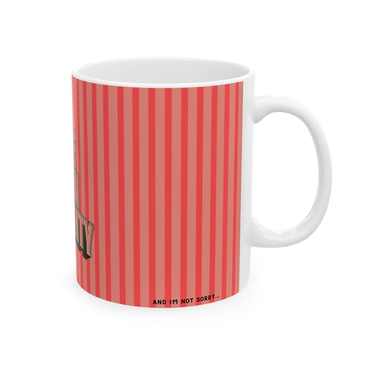 A white ceramic mug with a red and pink vertical striped pattern on the exterior, featuring partial text graphics and the phrase 'AND I'M NOT SORRY.