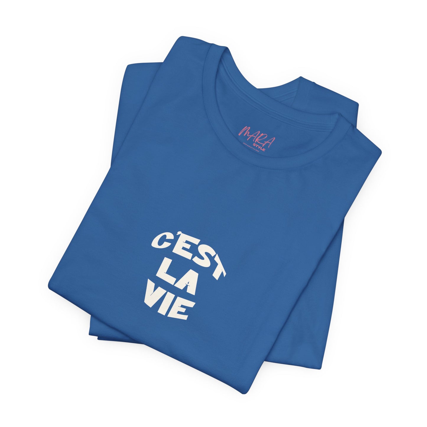 Folded blue t-shirt with 'C'est La Vie' text on a white background