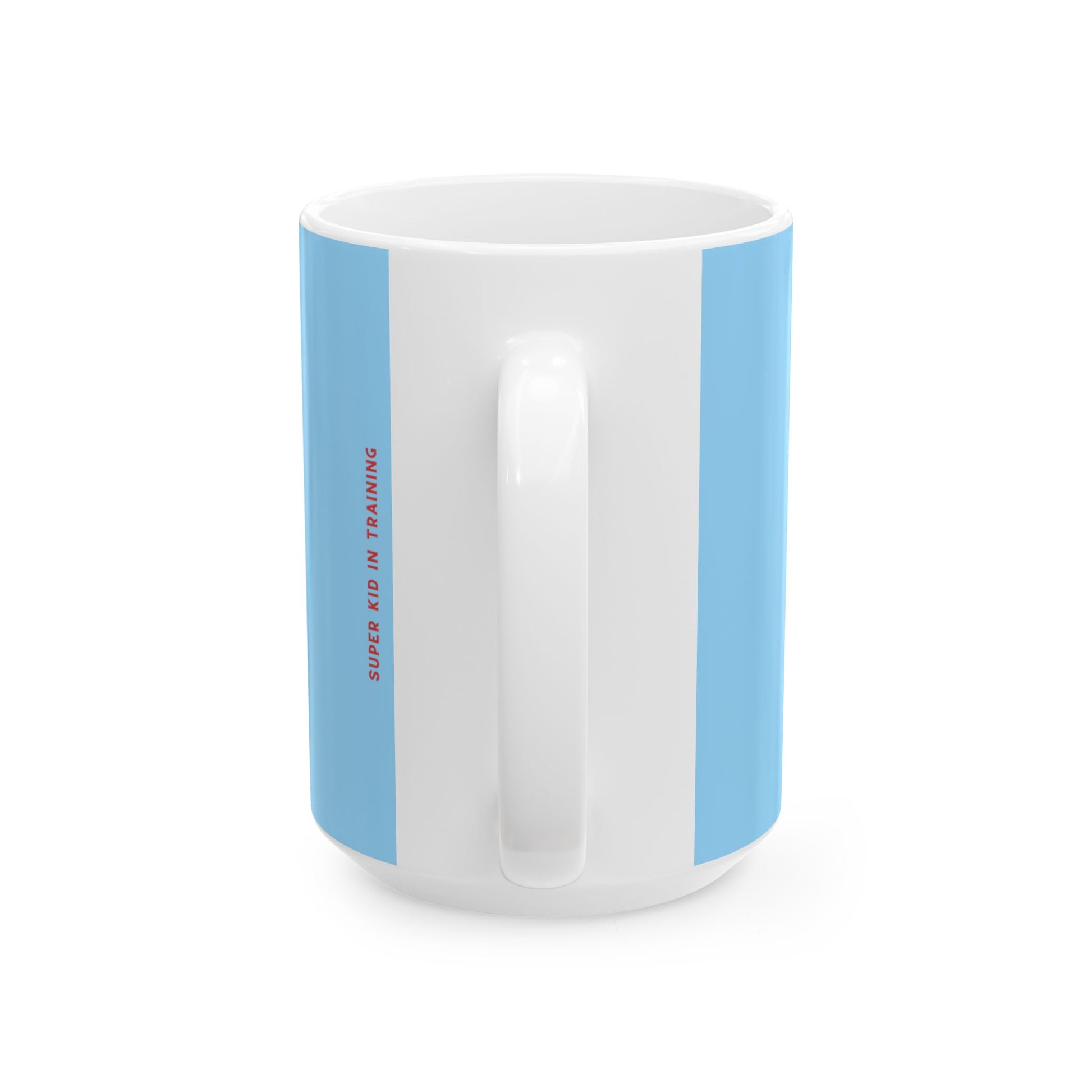 A white ceramic mug with light blue vertical side panels and small red vertical text reading 'SUPER KID IN TRAINING', shown on a clean white background.