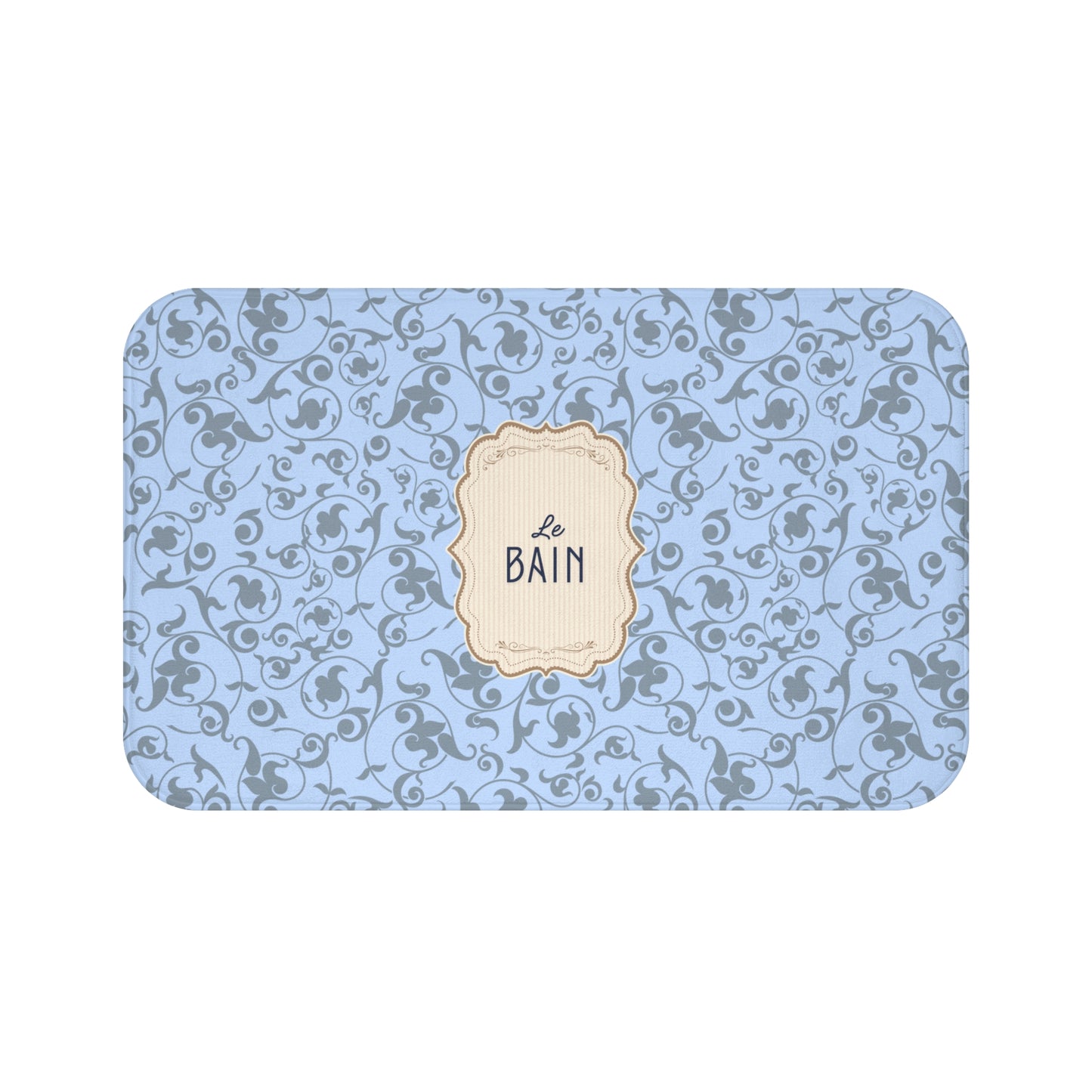 Decorative bath mat with blue floral pattern and 'Le Bain' label on a white background