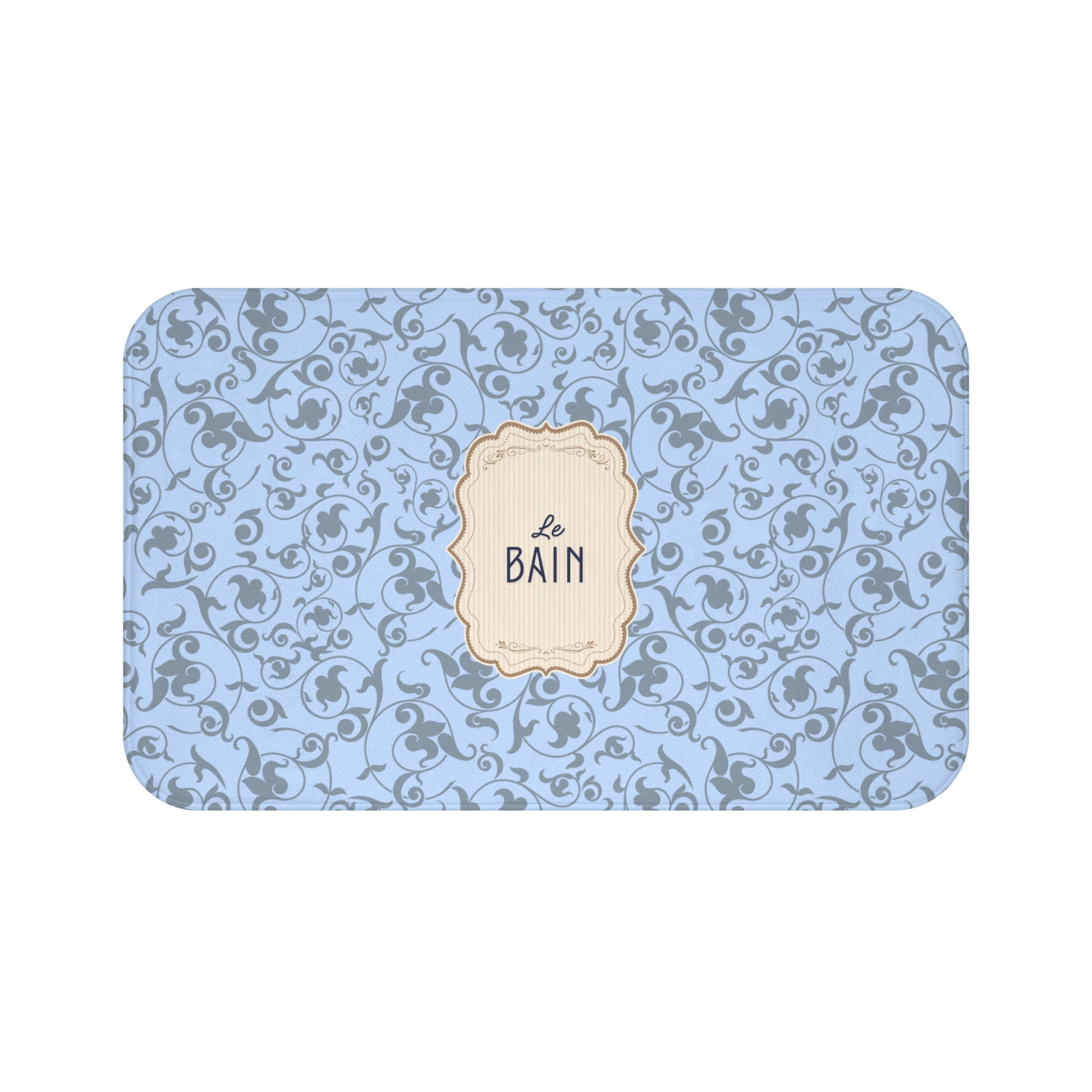 Decorative bath mat with blue floral pattern and 'Le Bain' label on a white background