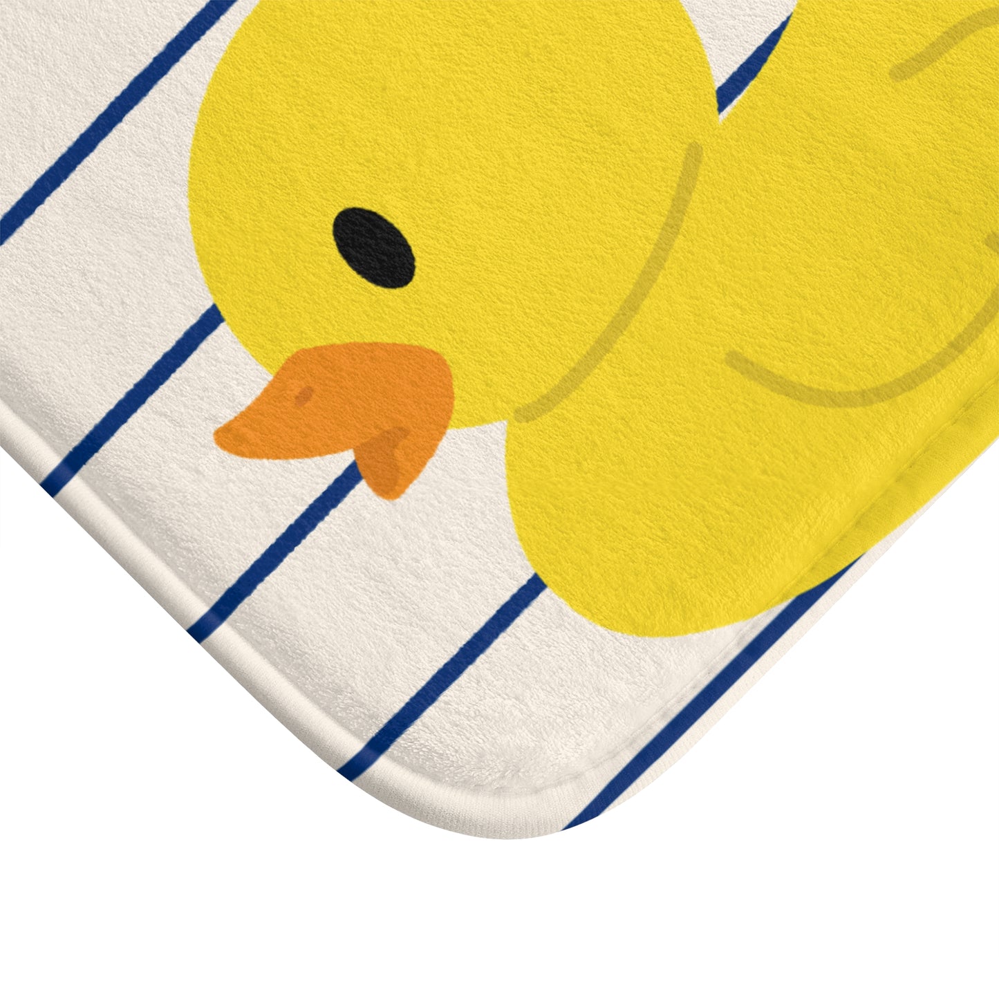 Yellow rubber duck on a white background with blue lines