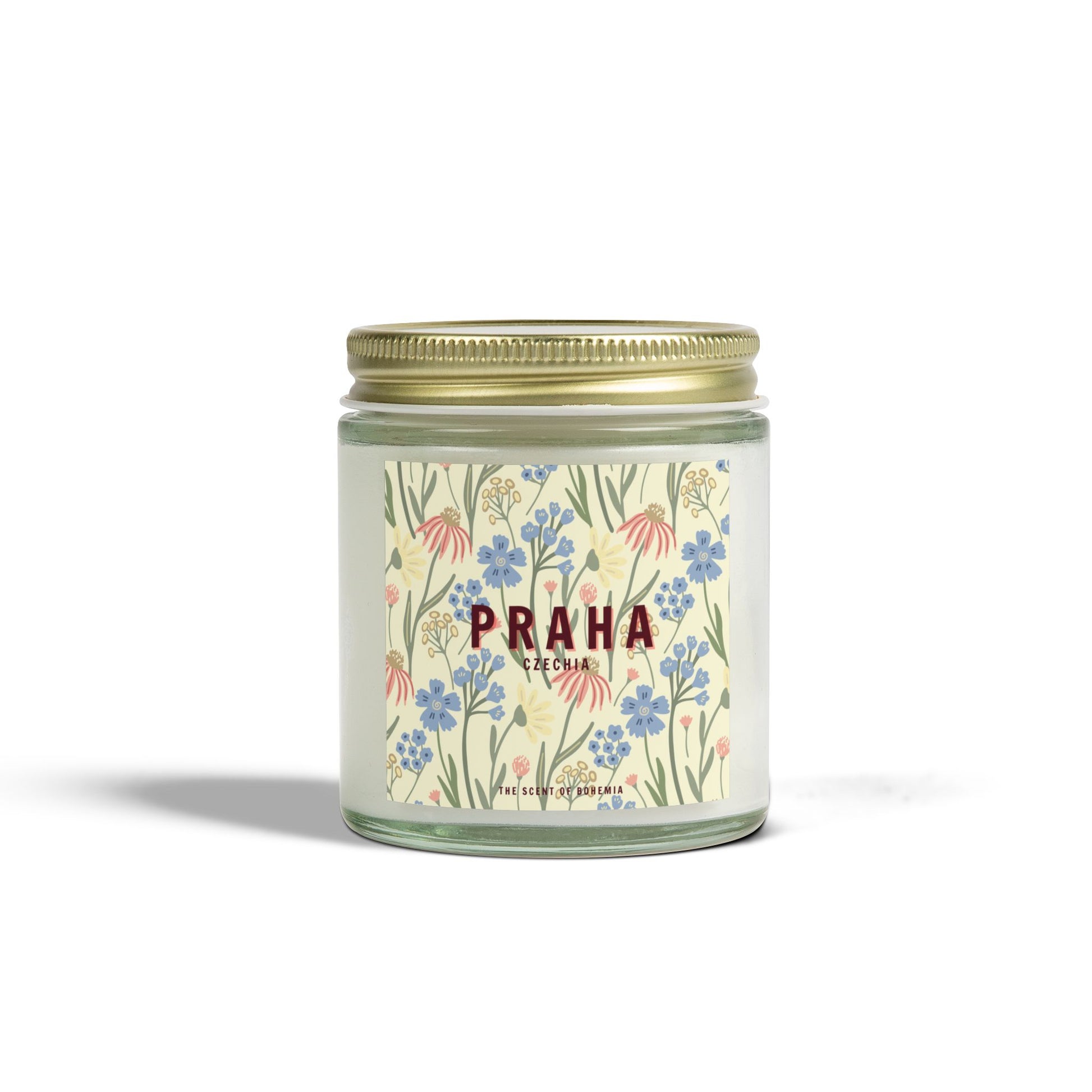 Candle with floral label and 'Praha' text on a white background