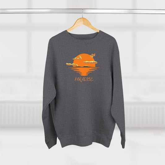 Gray sweatshirt with a sunset design and 'Paradise' text on a hanger against a white background