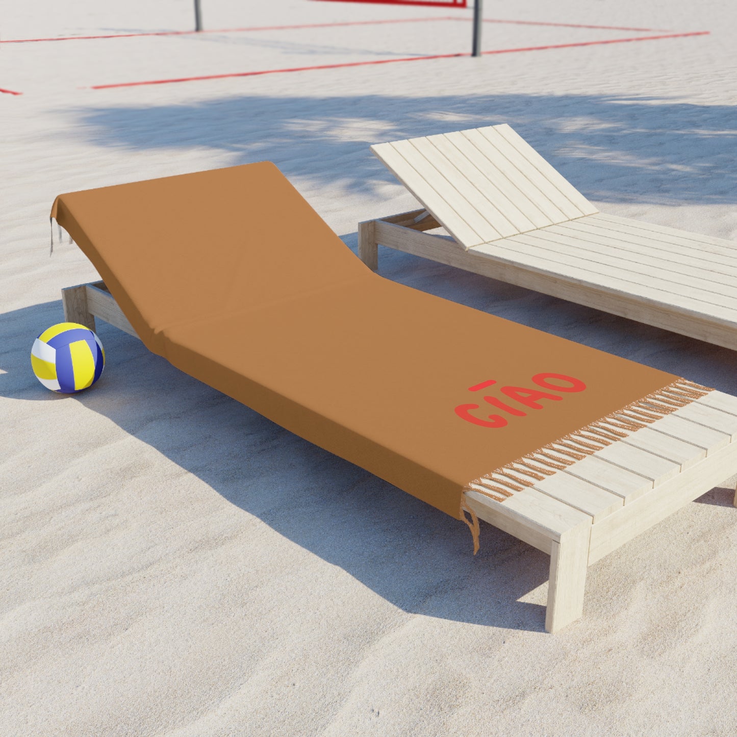 Beach chair with a brown cover labeled 'Cñco' on a sandy surface with a volleyball in the background.
