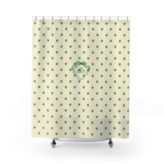Shower curtain with polka dot pattern and logo on a beige background