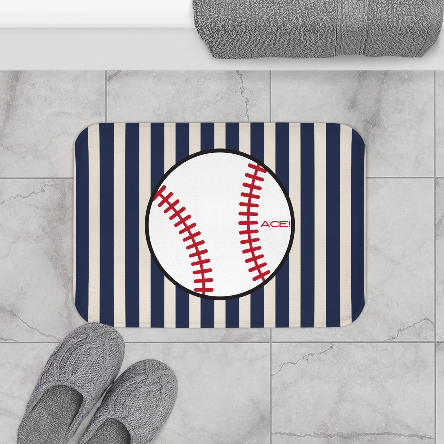 Doormat with baseball design and striped pattern on a tiled floor.