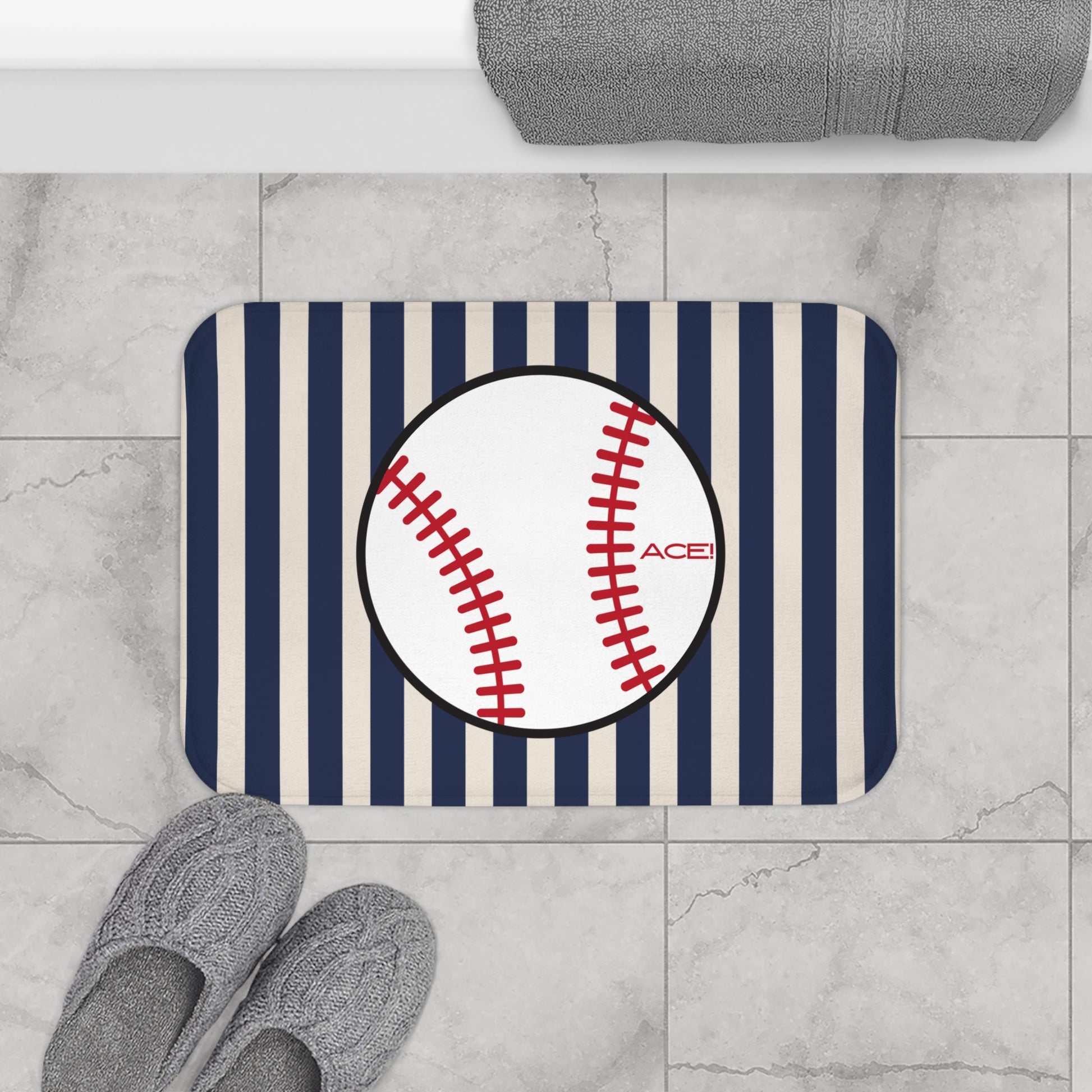 Doormat with baseball design and striped pattern on a tiled floor.