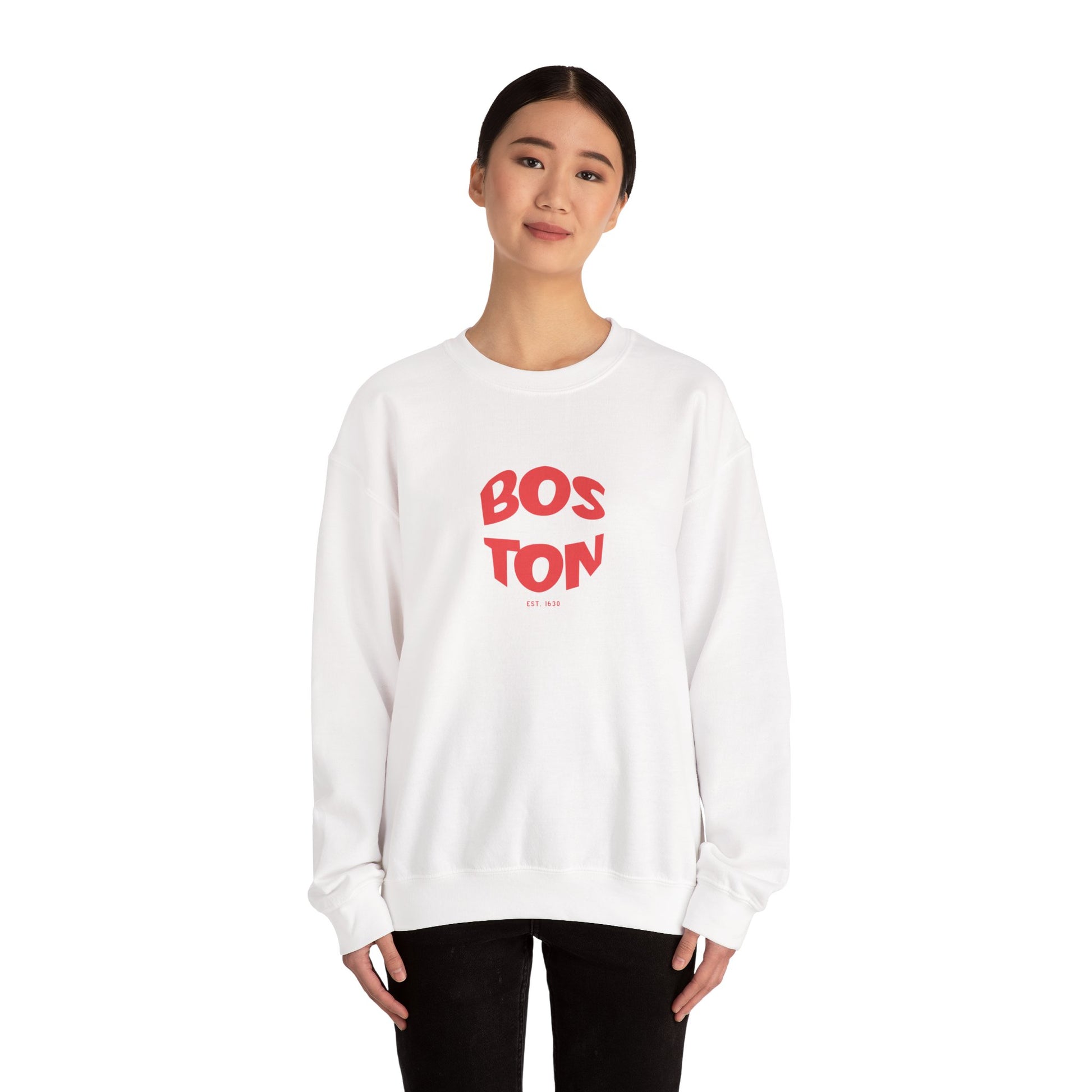 Person wearing a white sweatshirt with 'BOSTON' printed in red on a white background