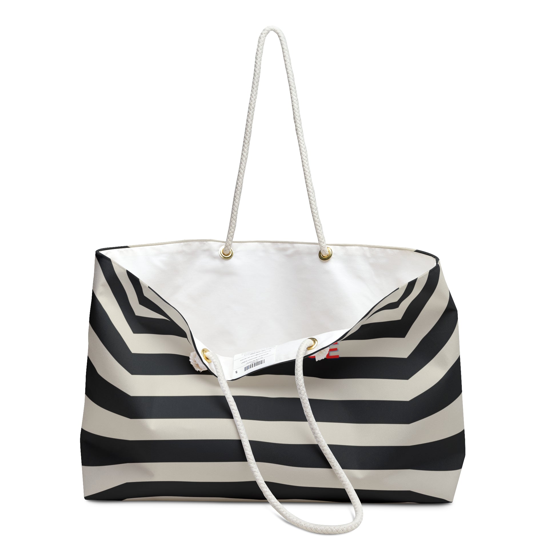 Black and white striped tote bag with a visible brand label on a white background